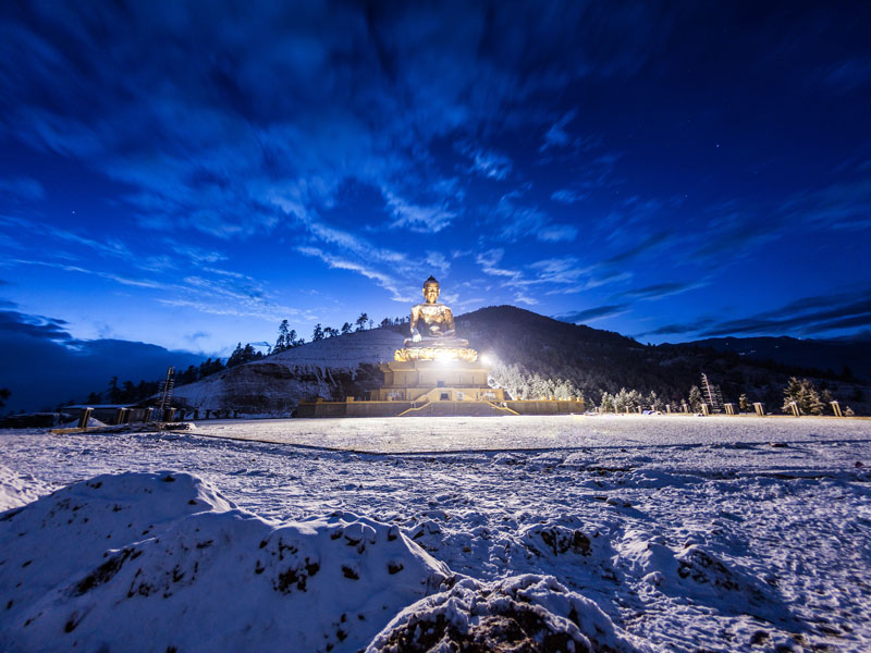 The buddha statue in Thimphu after a night of snow