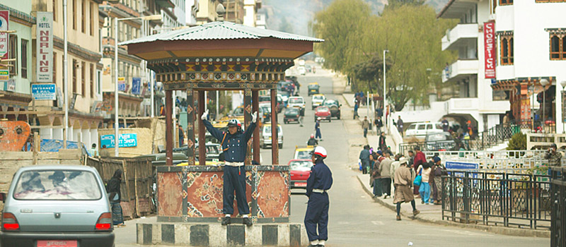 A traffic police directing vehicles in Thimphu